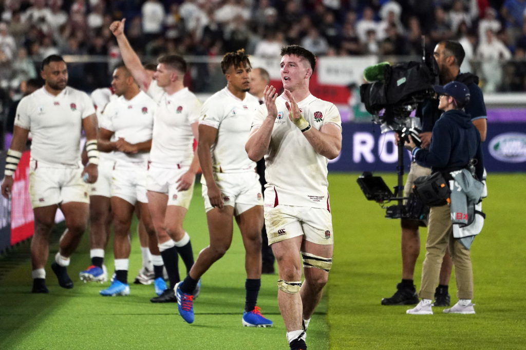 Tom Curry and his England teammates celebrate after beating new Zealand