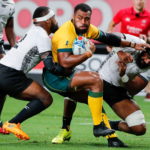 Samu Kerevi (C) of Australia in action against Fiji during the Rugby World Cup match between Australia and Fiji in Sapporo, Japan