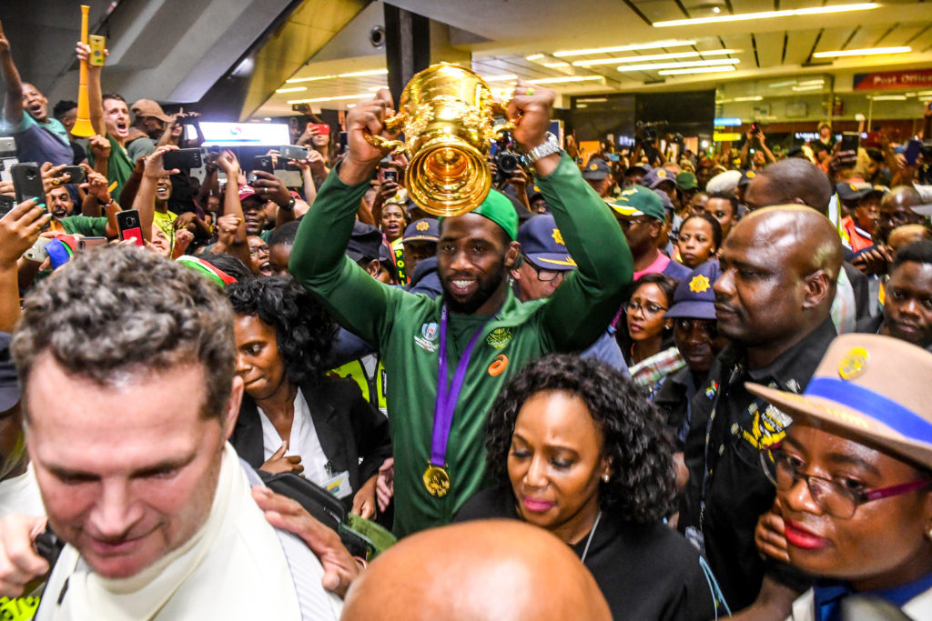 Siya Kolisi lifts the Webb Ellis trophy after the Springboks return from the World Cup