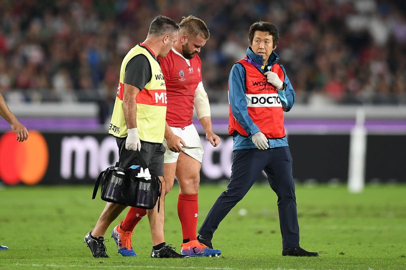 Wales prop Tomas Francis is help off the field/Getty Images