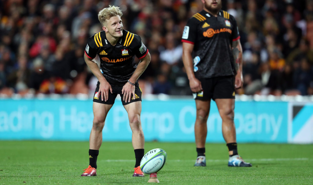 Chiefs Damian McKenzie looks to kick a goal during the round 9 Super Rugby match between the Chiefs and the Blues