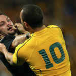 Richie McCaw of the All Blacks (L) jostles Quade Cooper of the Wallabies (R)during the Tri-Nations Bledisloe Cup match between the Australian Wallabies and the New Zealand All Blacks