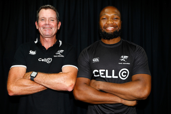 Sean Everitt and Lukhanyo Am in Sharks kit, arms folded