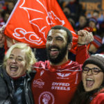 Uzair Cassiem celebrates with Scarlets fans