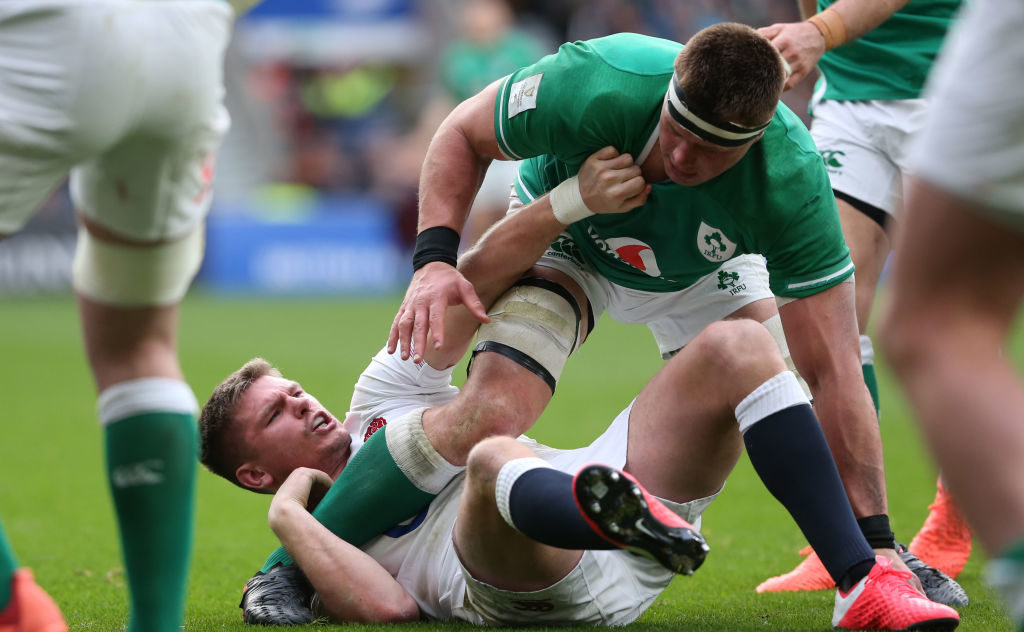 Owen Farrell of England holds firmly onto the leg of CJ Stander of Ireland during the 2020 Guinness Six Nations match between England and Ireland at Twickenham
