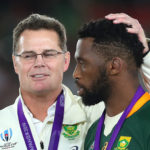 Springboks coach Rassie Erasmus, Head Coach of South Africa talks to Siya Kolisi of South Africa after victory in the Rugby World Cup 2019 Final between England and South Africa at International Stadium Yokohama on November 02, 2019