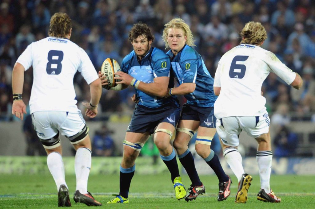 Duane Vermeulen and Schalk Burger about to tackle Danie Rossouw and Dewald Potgieter during the Super 14 final match between Vodacom Bulls and Vodacom Stormers from Orlando Stadium