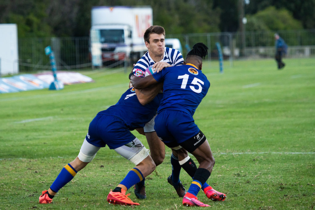 UCT's James Tedder collides with Wits' Daniel Kasende in the Varsity Cup