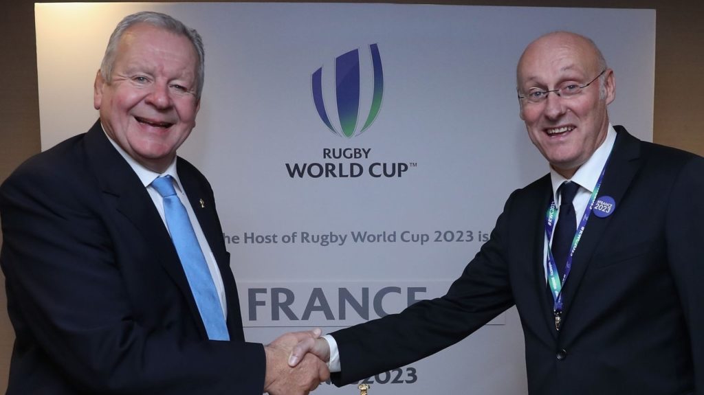 LONDON, ENGLAND - NOVEMBER 15: Bill Beaumont, (L) the World Rugby via Getty Images chairman, shakes hands with FFR President Bernard Laporte after the annoucement that France will host Rugby World Cup 2023 during the Rugby World Cup 2023 Host Decision at the Royal Garden Hotel on November 15, 2017 in London, England. (Photo by Dave Rogers - World Rugby via Getty Images/World Rugby via Getty Images)