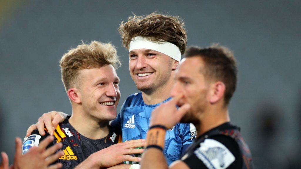 AUCKLAND, NEW ZEALAND - JULY 26: Damian McKenzie of the Chiefs talk to Beauden Barrett of the Blues after the round 7 Super Rugby Aotearoa match between the Blues and the Chiefs at Eden Park on July 26, 2020 in Auckland, New Zealand. (Photo by Hannah Peters/Getty Images)