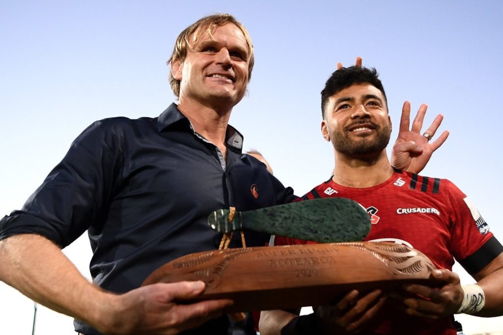 Head coach Scott Robertson and Richie Mo'unga of the Crusaders hold the Super Rugby Aotearoa trophy after winning the round 9 Super Rugby Aotearoa match between the Crusaders and the Highlanders at Orangetheory Stadium on August 09, 2020 in Christchurch, New Zealand. (Photo by Hannah Peters/Getty Images)