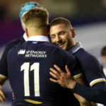 Duhan van der Merwe embraces Scotland teammate Finn Russell after scoring a debut try