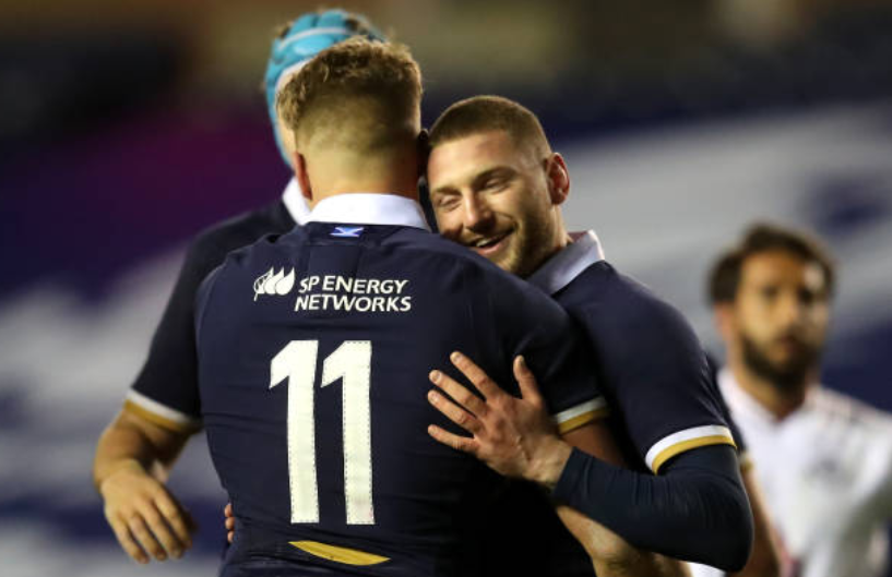 Duhan van der Merwe embraces Scotland teammate Finn Russell after scoring a debut try