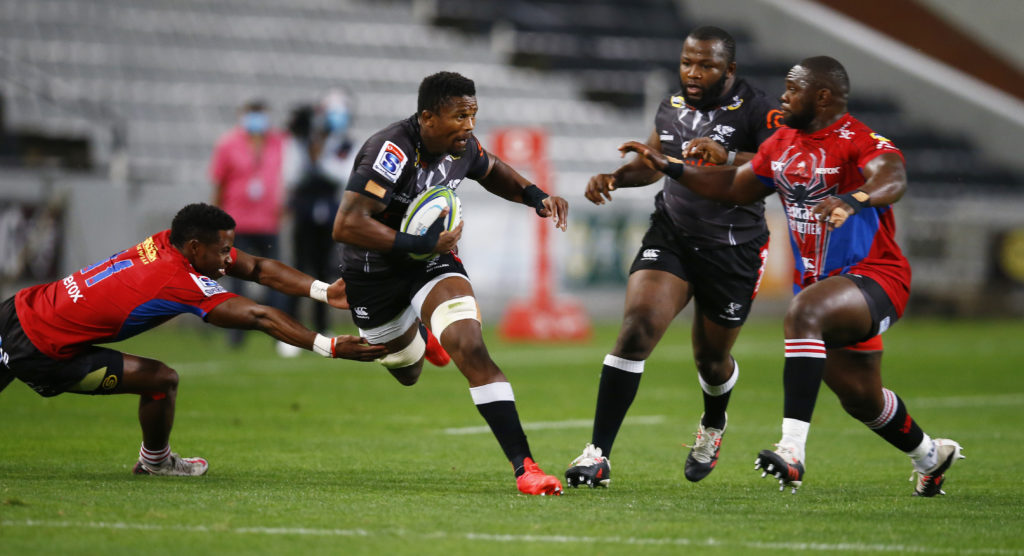 DURBAN, SOUTH AFRICA - OCTOBER 09: Sibahle Maxwane of the Emirates Lions looks to tackle Sikhumbuzo Notshe of the Cell C Sharks during the Super Rugby Unlocked match between Cell C Sharks and Emirates Lions at Jonsson Kings Park on October 09, 2020 in Durban, South Africa. (Photo by Steve Haag/Gallo Images)