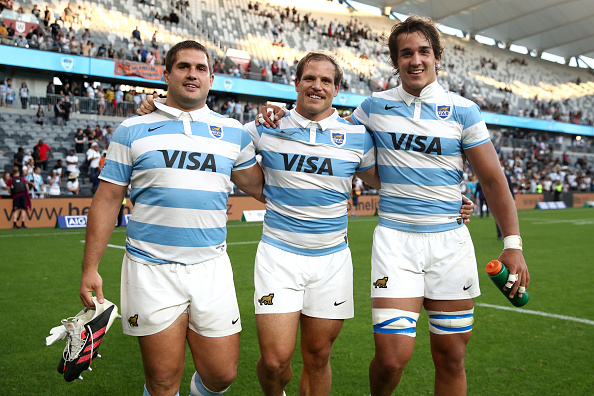 SYDNEY, AUSTRALIA - NOVEMBER 14: Francisco Gómez Kodela, Facundo Bosch and Santiago Grondona of Argentina celebrate after winning the 2020 Tri-Nations rugby match between the New Zealand All Blacks and the Argentina Los Pumas at Bankwest Stadium on November 14, 2020 in Sydney, Australia. (Photo by Cameron Spencer/Getty Images)
