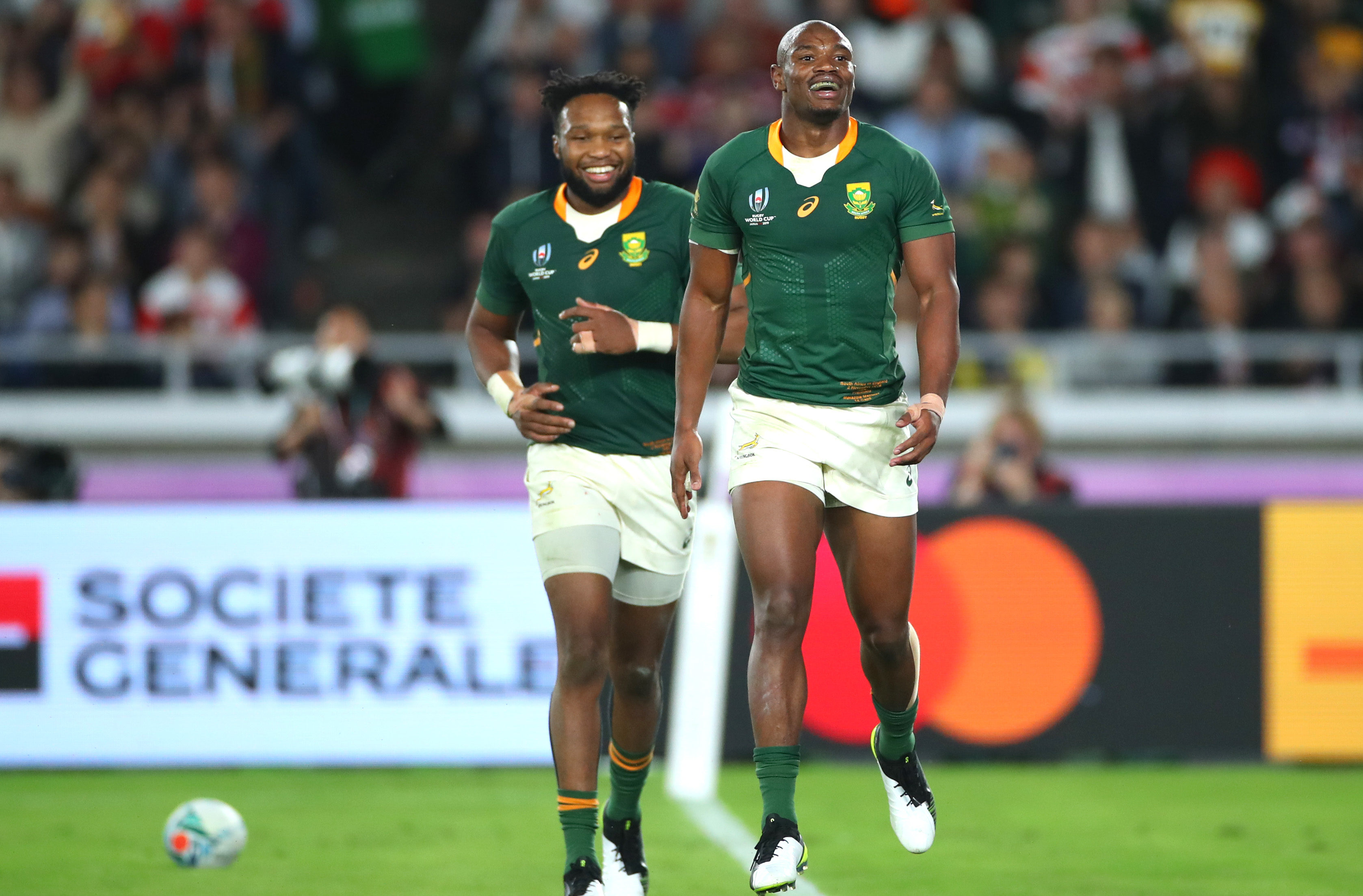 YOKOHAMA, JAPAN - NOVEMBER 02: Makazole Mapimpi of South Africa celebrates with team mate Lukhanyo Am after scoring their team's first try during the Rugby World Cup 2019 Final between England and South Africa at International Stadium Yokohama on November 02, 2019 in Yokohama, Kanagawa, Japan. (Photo by Cameron Spencer/Getty Images)