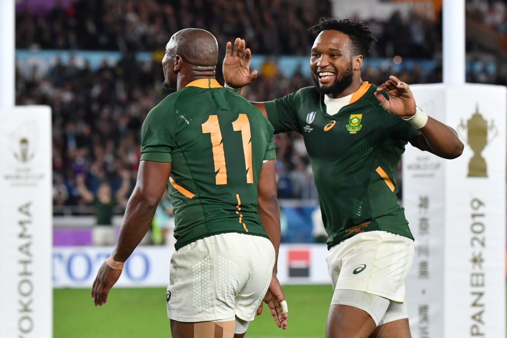 South Africa's wing Makazole Mapimpi is congratulated by South Africa's centre Lukhanyo Am (R) after scoring a try during the Japan 2019 Rugby World Cup final match between England and South Africa at the International Stadium Yokohama in Yokohama on November 2, 2019. (Photo by Kazuhiro NOGI / AFP) (Photo by KAZUHIRO NOGI/AFP via Getty Images)