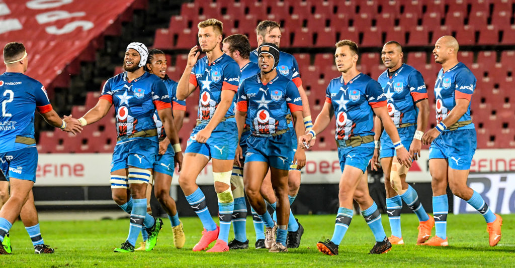 The Bulls celebrate a try against the Lions