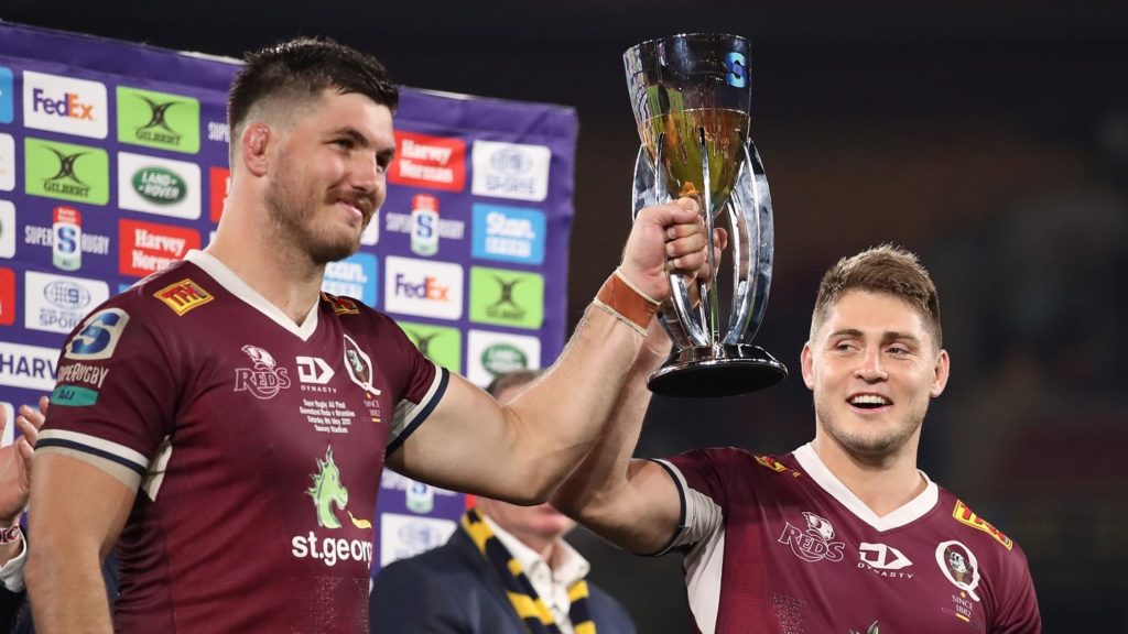 BRISBANE, AUSTRALIA - MAY 08: Liam Wright and James O'Connor of the Reds hold the trophy after winning the Super RugbyAU Final match between the Queensland Reds and the ACT Brumbies at Suncorp Stadium, on May 08, 2021, in Brisbane, Australia. (Photo by Jono Searle/Getty Images)