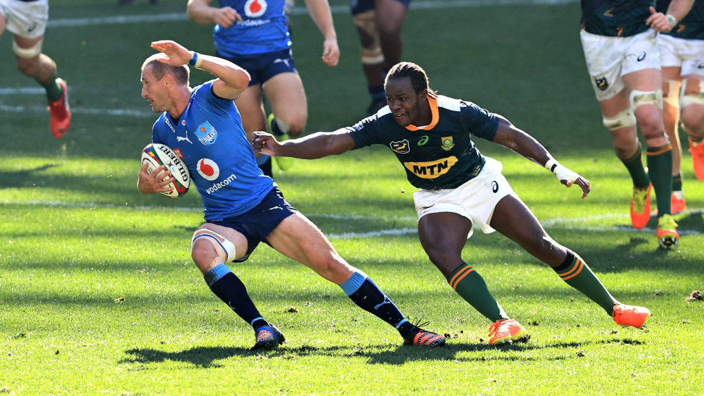 CAPE TOWN, SOUTH AFRICA - JULY 17: Johan Goosen of the Vodacom Bulls moves away from Yaw Penxe during the match between South Africa A and Vodacom Bulls at Cape Town Stadium on July 17, 2021 in Cape Town, South Africa.