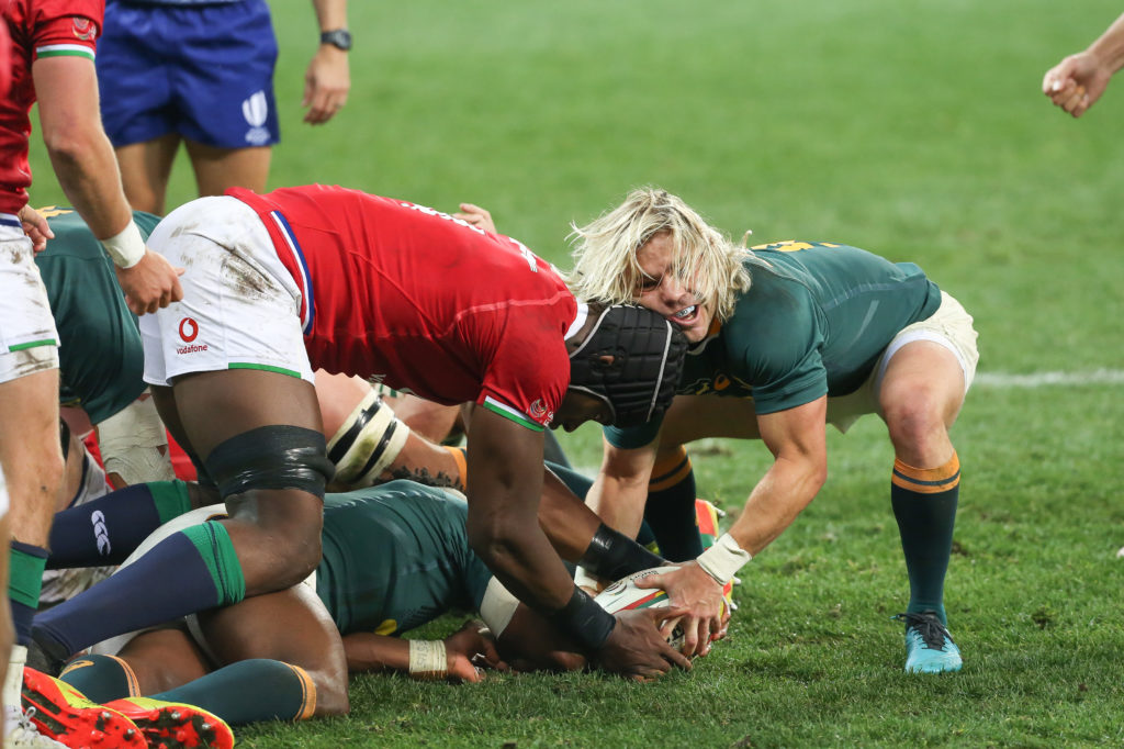 Faf de Klerk of the Springboks fighting with Maro Itoje of the B&I Lions for the ball during the Castle Lager Lions Series 1st Test match between South Africa and British and Irish Lions at Cape Town Stadium on July 24, 2021 in Cape Town, South Africa.