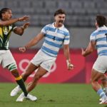 South Africa's Justin Geduld (L) gestures as Argentina's Ignacio Mendy (C) and teammate Luciano Gonzalez celebrate winning the men's quarter-final rugby sevens match between South Africa and Argentina during the Tokyo 2020 Olympic Games at the Tokyo Stadium in Tokyo on July 27, 2021. (Photo by Ben STANSALL / AFP) (Photo by BEN STANSALL/AFP via Getty Images)