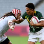 Tokyo , Japan - 28 July 2021; Ronald Brown of South Africa is tackled by Folau Niua of United States during the Men's Rugby Sevens 5th placed play-off match between USA and South Africa at the Tokyo Stadium during the 2020 Tokyo Summer Olympic Games in Tokyo, Japan.