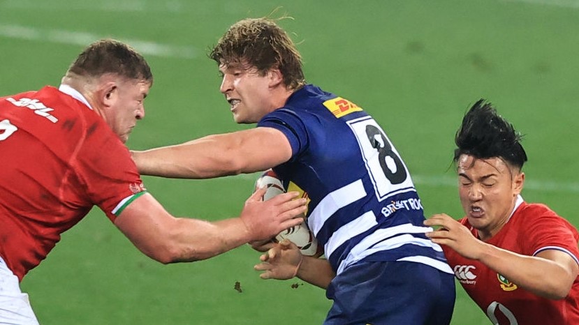 CAPE TOWN, SOUTH AFRICA - JULY 17: Evan Roos of DHL Stormers is tackled by Marcus Smith and Tadhg Furlong of the British & Irish Lions during the match between DHL Stormers and British & Irish Lions at Cape Town Stadium on July 17, 2021 in Cape Town, South Africa. (Photo by David Rogers/Getty Images)