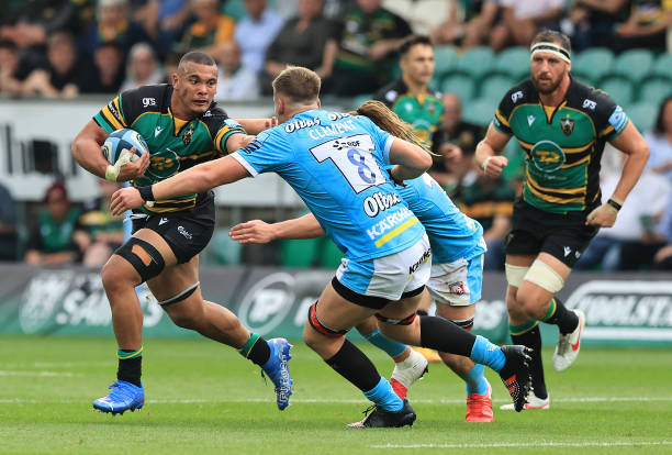 NORTHAMPTON, ENGLAND - SEPTEMBER 18: Juarno Augustus of Northampton Saints holds off Jack Clement during the Gallagher Premiership Rugby match between Northampton Saints and Gloucester Rugby at Franklin's Gardens on September 18, 2021 in Northampton, England.