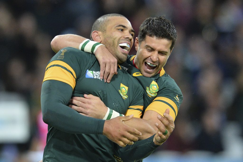 South Africa's wing Bryan Habana (L) celebrates with South Africa's fly half Morne Steyn after scoring his second and his team's sixth try during a Pool B match of the 2015 Rugby World Cup between South Africa and USA at the Olympic Stadium, east London, on October 7, 2015. AFP PHOTO / GLYN KIRK RESTRICTED TO EDITORIAL USE, NO USE IN LIVE MATCH TRACKING SERVICES, TO BE USED AS NON-SEQUENTIAL STILLS