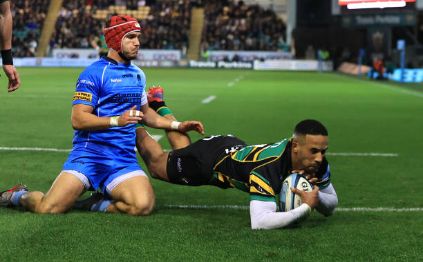 NORTHAMPTON, ENGLAND - OCTOBER 22: Courtnall Skosan of Northampton Saints dives to score his first of three tries during the Gallagher Premiership Rugby match between Northampton Saints and Worcester Warriors at Franklin's Gardens on October 22, 2021 in Northampton, England.
