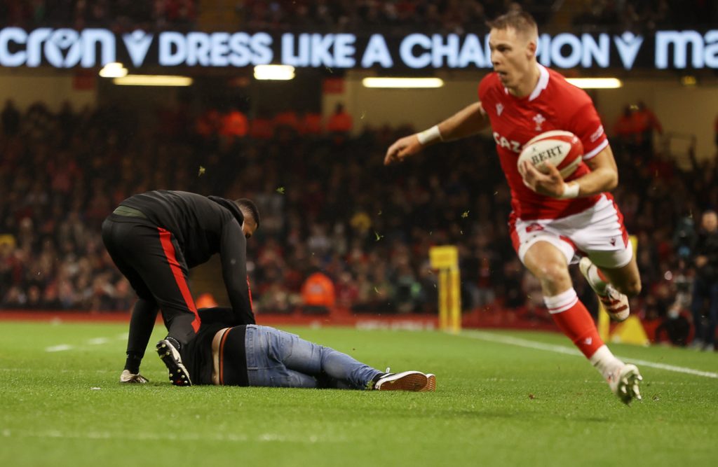 Mandatory Credit: Photo by Chris Fairweather/Huw Evans/Shutterstock/BackpagePix (12591897au) Liam Williams of Wales has to step around a pitch invader during the match. Wales v South Africa - Autumn Nations Series - 06 Nov 2021