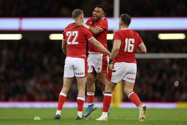 CARDIFF, WALES - NOVEMBER 20: Rhys Priestland of Wales celebrates with teammates Uilisi Halaholo and Elliot Dee after kicking the winning penalty during the Autumn Nations Series match between Wales and Australia at Principality Stadium on November 20, 2021 in Cardiff, Wales.