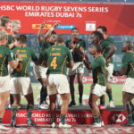 epa09621461 Players of South Africa celebrate with the trophy after winning the Emirates Dubai 7s Rugby tournament final match between Australia and South Africa in Dubai, United Arab Emirates, 04 December 2021. EPA/ALI HAIDER