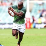 SYDNEY, AUSTRALIA - FEBRUARY 06: Sandile Ngcobo of South Africa gets away from the Scottish defence during the day 1 match between South Africa and Scotland at the HSBC Sydney Sevens at Allianz Stadium on February 06, 2016 in Sydney, Australia.