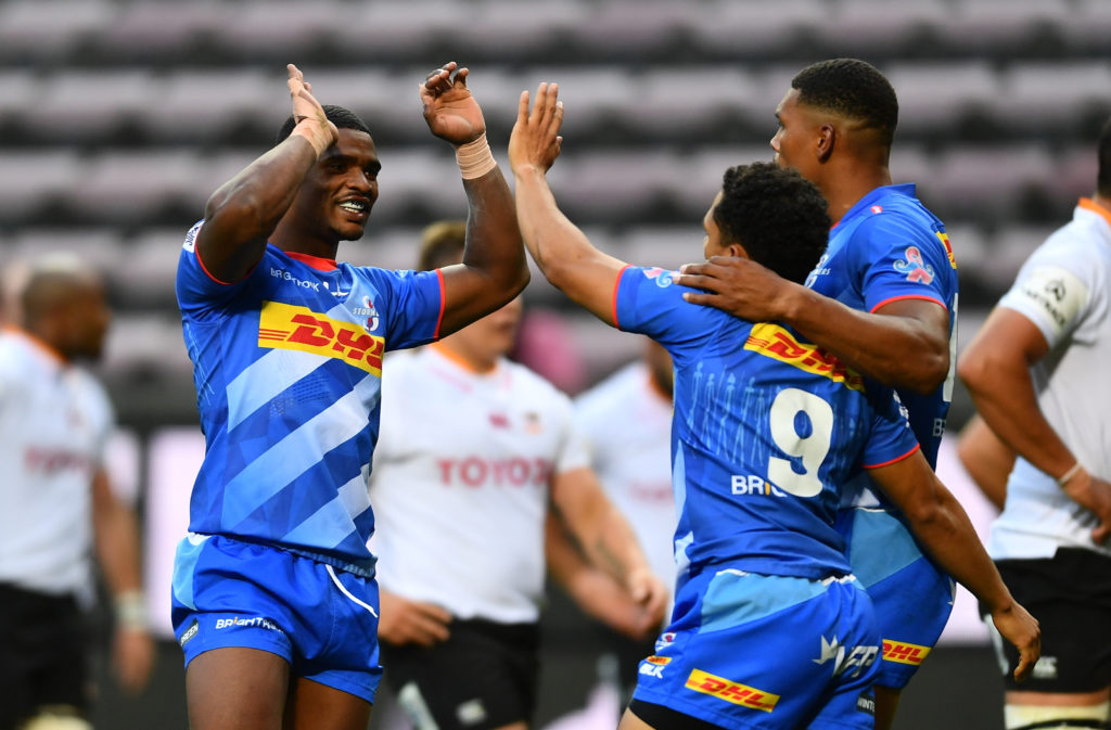 CAPE TOWN, SOUTH AFRICA - NOVEMBER 14: Herschel Jantjies of the Stormers celebrate the try with Damian Willemse and Warrick Gelant of the Stormers during the Super Rugby Unlocked match between DHL Stormers and Toyota Cheetahs at DHL Newlands on November 14, 2020 in Cape Town, South Africa.