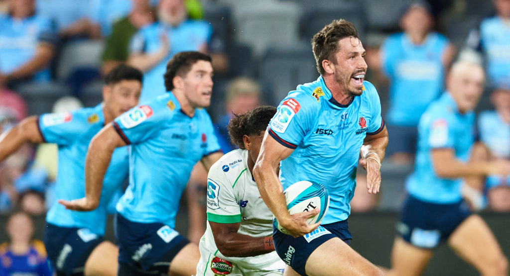 SYDNEY, AUSTRALIA - FEBRUARY 18: Jake Gordon of the Waratahs makes a break during the round one Super Rugby Pacific match between the Waratahs and the Fijian Drua at CommBank Stadium on February 18, 2022 in Sydney, Australia.