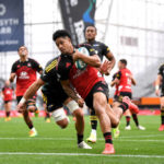 DUNEDIN, NEW ZEALAND - FEBRUARY 19: Leicester Fainga’anuku of the Crusaders dives over to score a try during the round one Super Rugby Pacific match between the Crusaders and the Hurricanes at Forsyth Barr Stadium on February 19, 2022 in Dunedin, New Zealand.