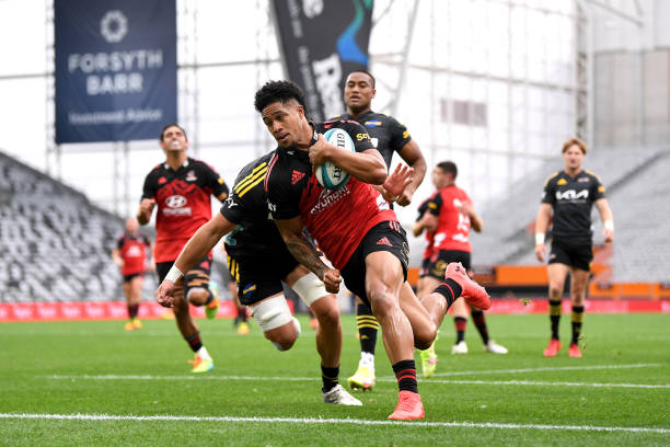 DUNEDIN, NEW ZEALAND - FEBRUARY 19: Leicester Fainga’anuku of the Crusaders dives over to score a try during the round one Super Rugby Pacific match between the Crusaders and the Hurricanes at Forsyth Barr Stadium on February 19, 2022 in Dunedin, New Zealand.