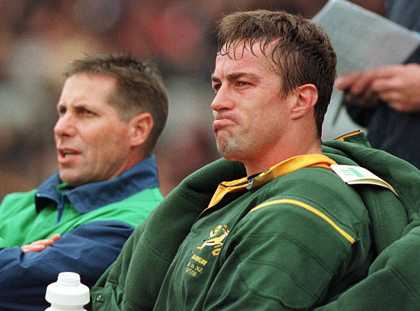CHRISTCHURCH, NEW ZEALAND - JULY 22: Springboks yellow carded Corne Krige sits on the bench next to backup referee Colin Hawk against the All Blacks in the Tri Nations at Jade Stadium, Christchurch, Saturday. New Zealand won 2512.