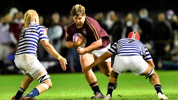CAPE TOWN, SOUTH AFRICA - MARCH 28: Sean Swart of Maties tackled by Keagan Blanckenberg of Ikeys and Taariq Kruger of Ikeys during the FNB Varsity Cup match between FNB UCT Ikeys and FNB Maties at UCT Rugby Fields on March 28, 2022 in Cape Town, South Africa. (Photo by Ashley Vlotman/Gallo Images)