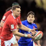 CARDIFF, WALES - MARCH 11: Dan Biggar of Wales is watched by Antoine Dupont of France during the Guinness Six Nations Rugby match between Wales and France at Principality Stadium on March 11, 2022 in Cardiff, Wales. (Photo by David Rogers/Getty Images)