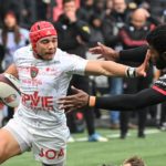 Toulon's South African winger Cheslin Kolbe (L) hands off Lyon's Fijian wing Noa Seru Nakaitaci during the French Top 14 rugby union match between Lyon (LOU) and Toulon (RCT) at the Matmut Stadium de Gerland in Lyon, eastern France, on April 2, 2022. (Photo by OLIVIER CHASSIGNOLE / AFP) (Photo by OLIVIER CHASSIGNOLE/AFP via Getty Images)