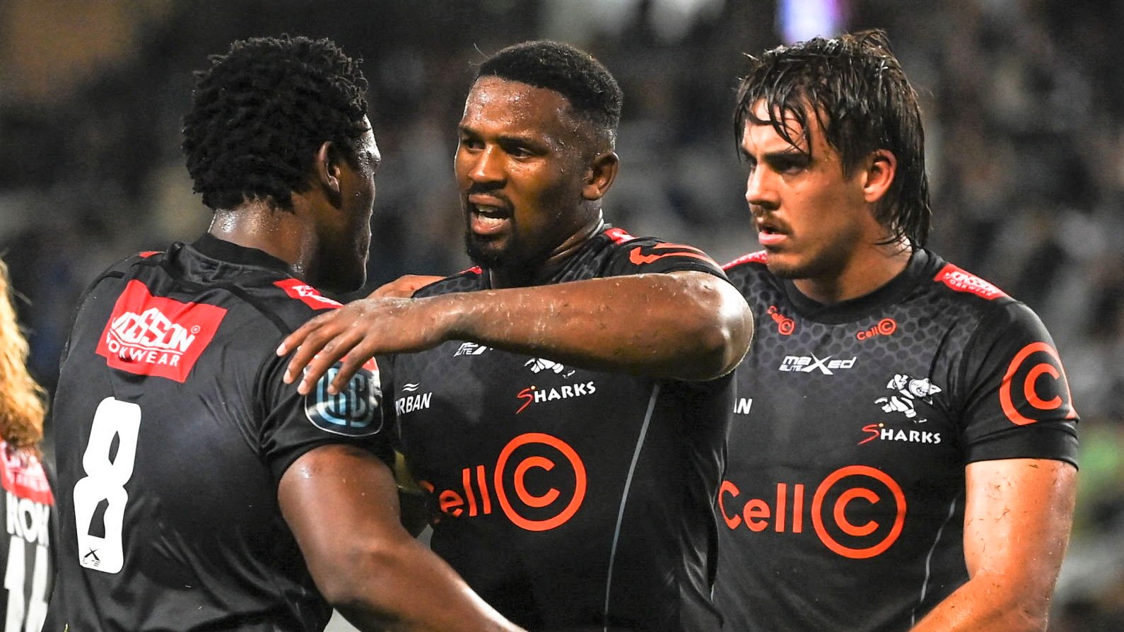 Durban , South Africa - 23 April 2022; Sikhumbuzo Notshe, centre, and Phepsi Buthelezi of Cell C Sharks embrace after their side's victory in the United Rugby Championship match between Cell C Sharks and Leinster at Hollywoodbets Kings Park Stadium in Durban, South Africa. (Photo By Harry Murphy/Sportsfile via Getty Images)