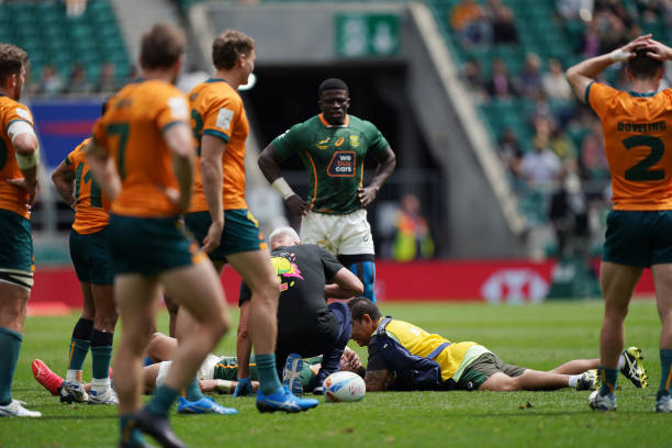 South Africa's Muller du Plessis receives medical attention during match 32 on day two of the HSBC World Rugby Sevens Series at Twickenham Stadium, London. Picture date: Sunday May 29, 2022.