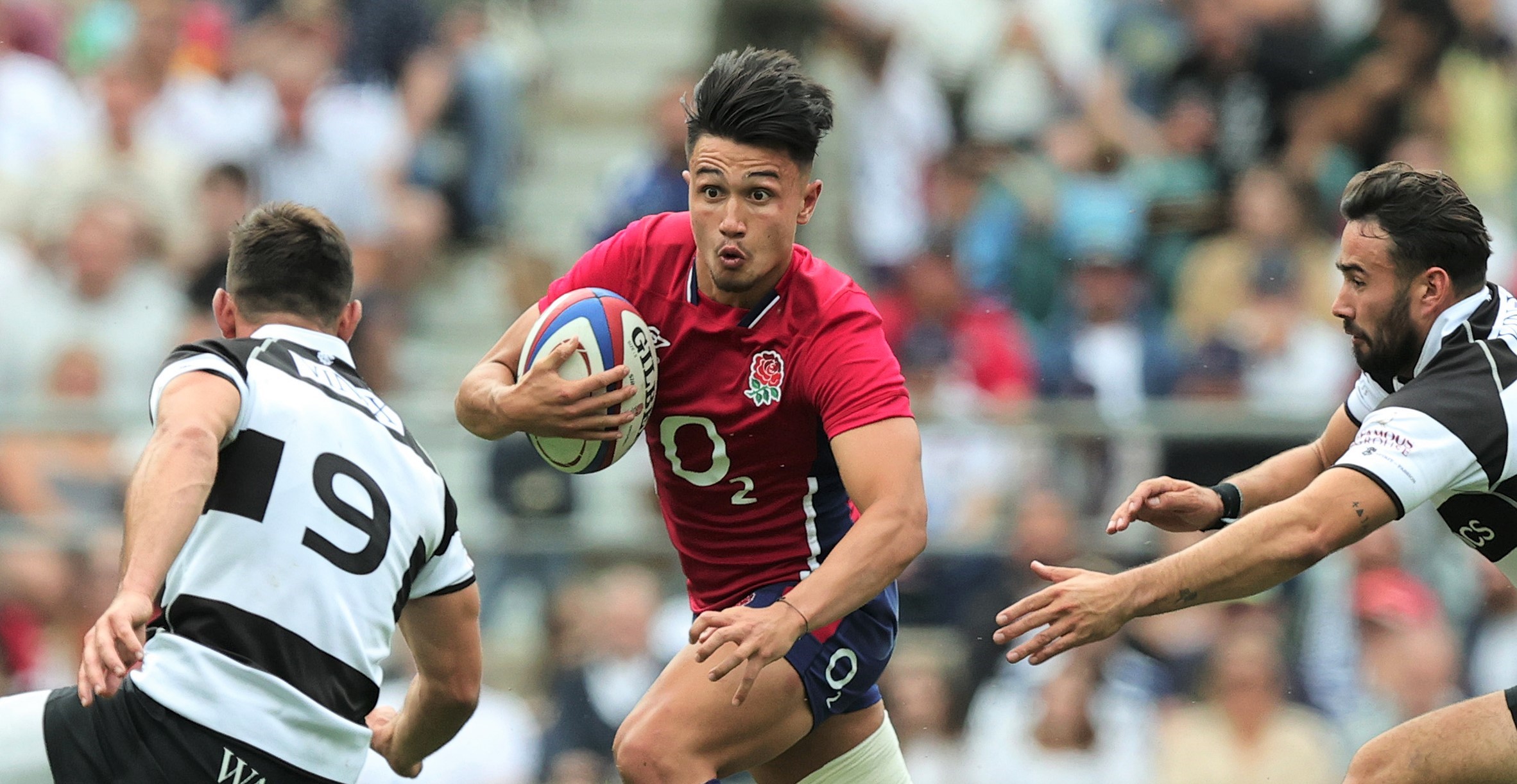 LONDON, ENGLAND - JUNE 19: Marcus Smith of England runs with the ball during the International match between England and Barbarians at Twickenham Stadium on June 19, 2022 in London, England. (Photo by David Rogers/Getty Images)