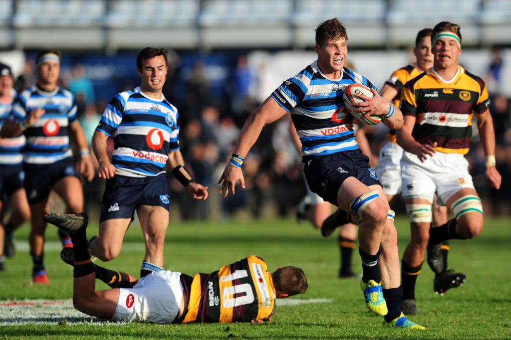 Evan Roos of Paarl Boys High evades a tackle from Charl Janson of Paarl Gymnasium on his way to scoring a try during the 2018 Premier Interschools game between Paarl Boys High and Paarl Gymnasium at Faure Street Stadium in Paarl on 4 August 2018