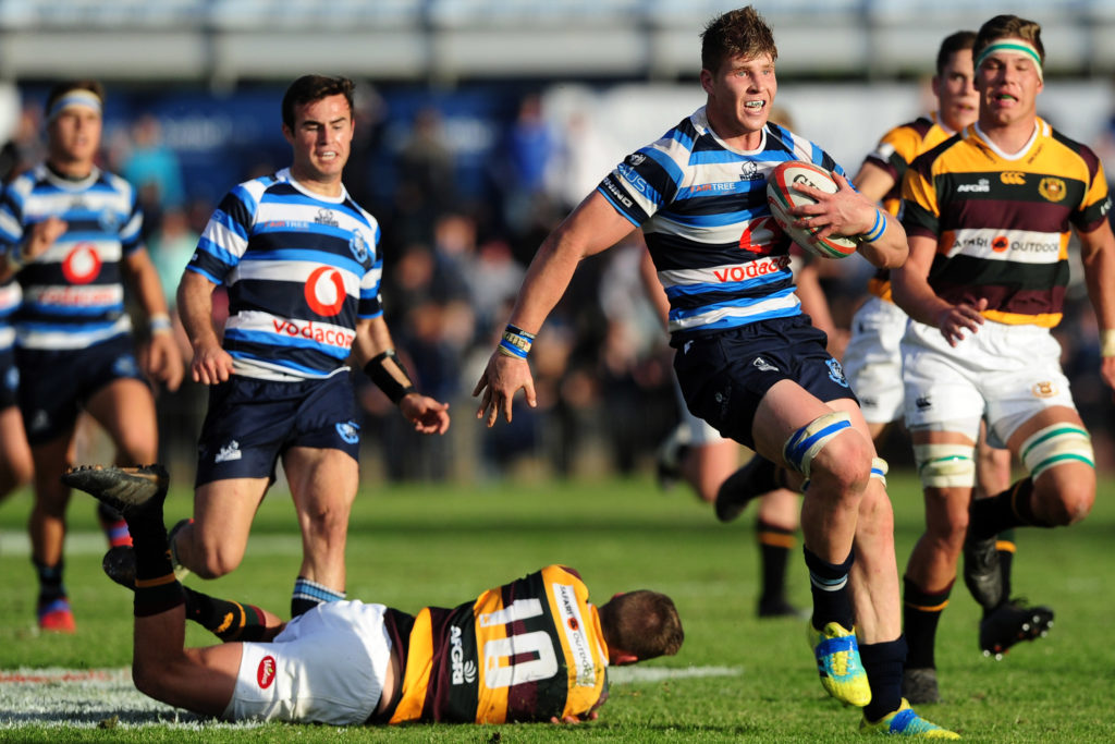 Evan Roos of Paarl Boys High evades a tackle from Charl Janson of Paarl Gymnasium on his way to scoring a try during the 2018 Premier Interschools game between Paarl Boys High and Paarl Gymnasium at Faure Street Stadium in Paarl on 4 August 2018