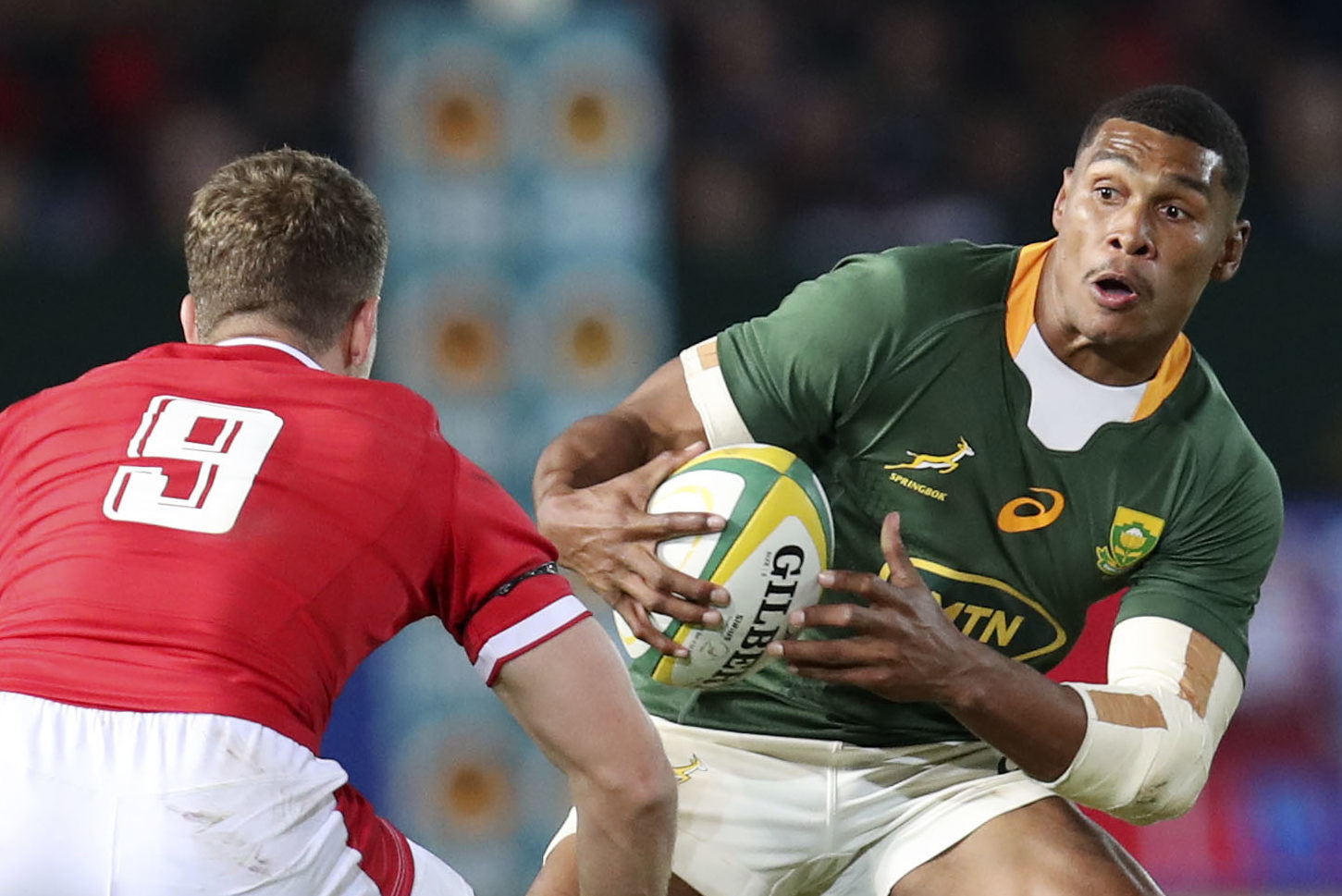 Damian Willemse of South Africa challenged by Kieran Hardy (l) and Adam Beard of Wales during the 2022 Castle Lager Incoming Series match between South Africa and Wales at Loftus Stadium, Pretoria on the 02 July 2022 ©Muzi Ntombela/BackpagePix