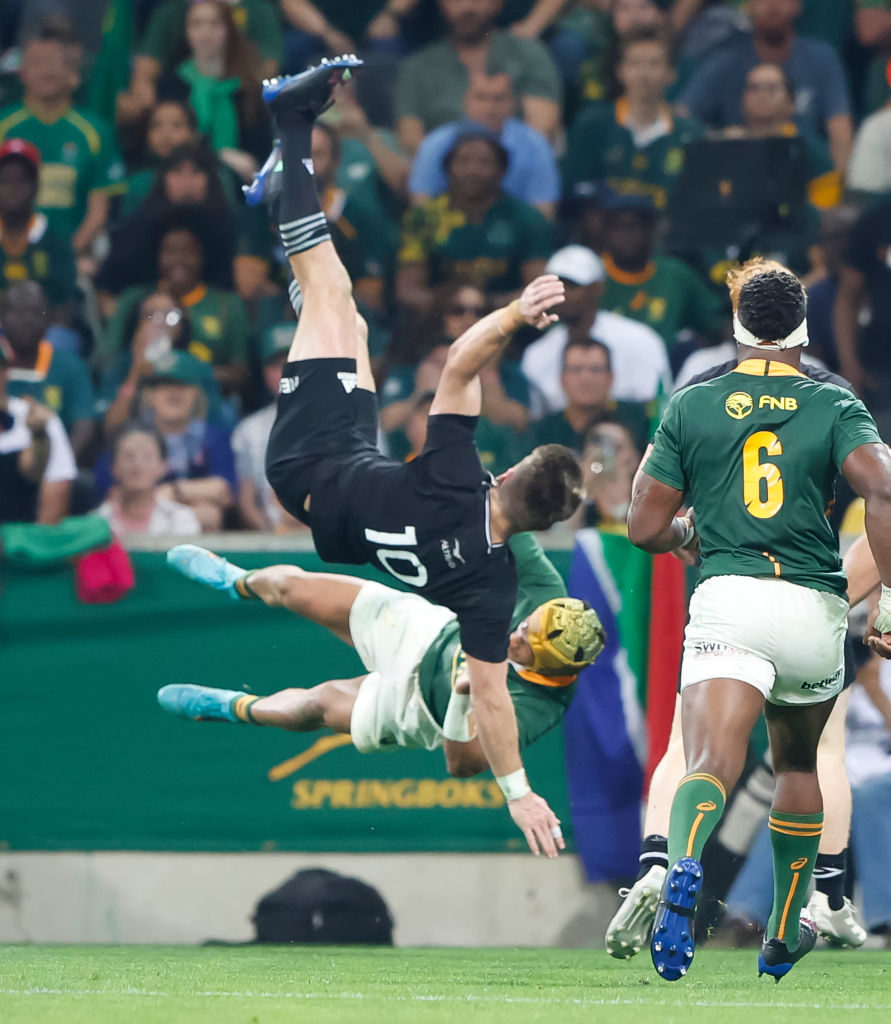 NELSPRUIT, SOUTH AFRICA - AUGUST 06: Beauden Barrett of New Zealand and Kurt-Lee Arendse of South Africa during The Rugby Championship match between South Africa and New Zealand at Mbombela Stadium on August 06, 2022 in Nelspruit, South Africa.